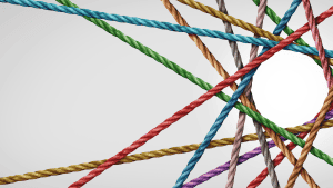 Different colored ropes on beige background for content.