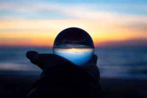 A crystal ball against the sky to represent the future.