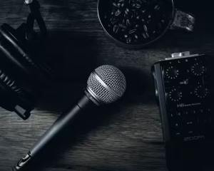 A microphone on a dark table to represent a brand voice.