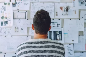 The Narrative Of Success: A Comprehensive Guide To Brand Storytelling 3 A man looking at various diagrams and information.