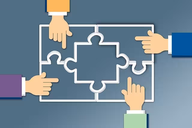 Four hands putting puzzle pieces together for company culture.