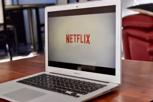 How To Define Company Core Values: A 5-Step Framework For Success 3 Netflix on a laptop on a table.