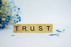 15 Powerful User-Generated Content Examples To Drive Trust &Amp; Sales 1 Trust spelled out in scrabble letters on a white background.