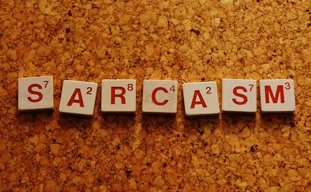 Sarcasm spelled out in scrabble letters to represent the sarcastic tone.