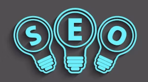 Seo spelled out in three blue lightbulbs.