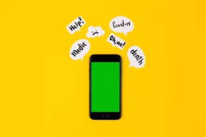 A smartphone with alerts on a yellow background.