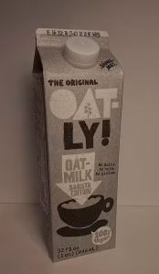 A milk container of the oatly brand.