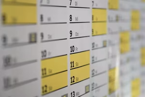 A Comprehensive Guide: How To Automate Timesheets With Geofencing For Field Staff 3 A yellow and white calendar.