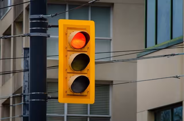 A traffic signal with a red light for traffic management.