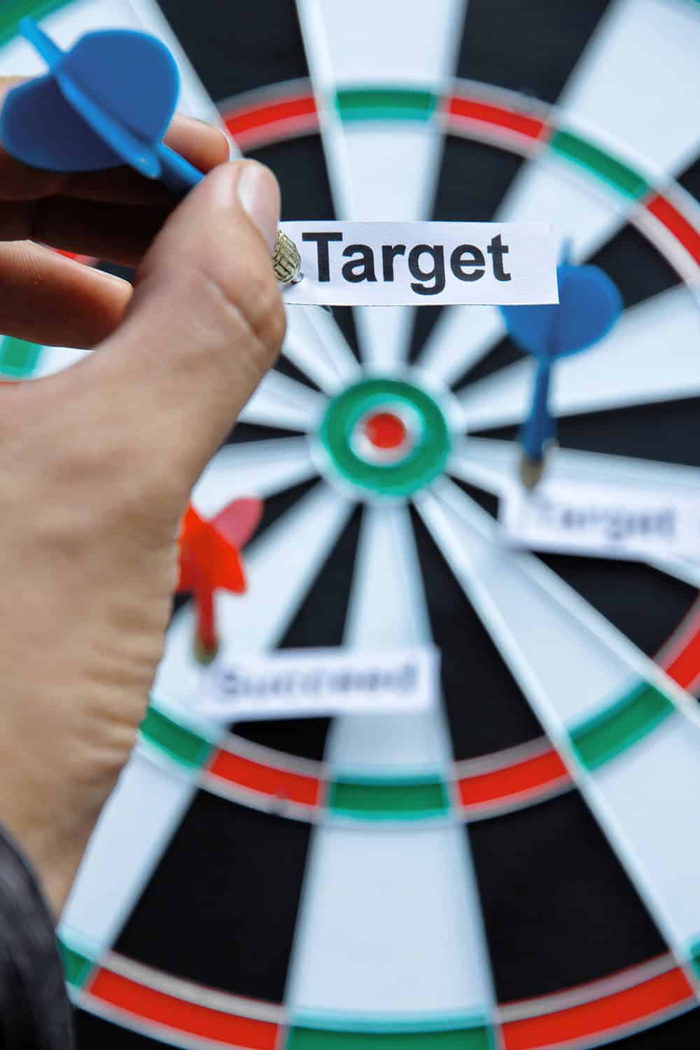 A dart board with darts on it.